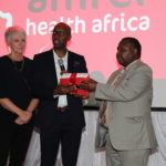 Amref global CEO Dr Gitahi Githinji (middle), hand over the strategy  to Head of Directorate of UHC and Health Financing in the Ministry of Health Dr David Kariuki (right) as Amref International Board Vice Chair Mary Anne Mackenzie looks on .