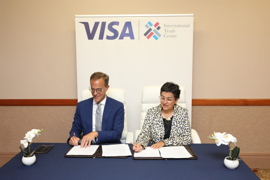 Ambassador Demetrios Marantis, Senior Vice President & Head, Global Government Engagement at VISA and Ms. Arancha González Executive Director International Trade Centre signing MOU to empower women-led businesses to trade globally at the 28th World Economic Forum.