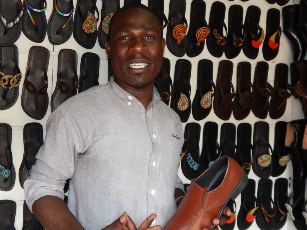 Julius Okoth Otieno, founder and CEO of Reafric social enterprise, an organization that recycles industrial waste to make shoes for sale.
